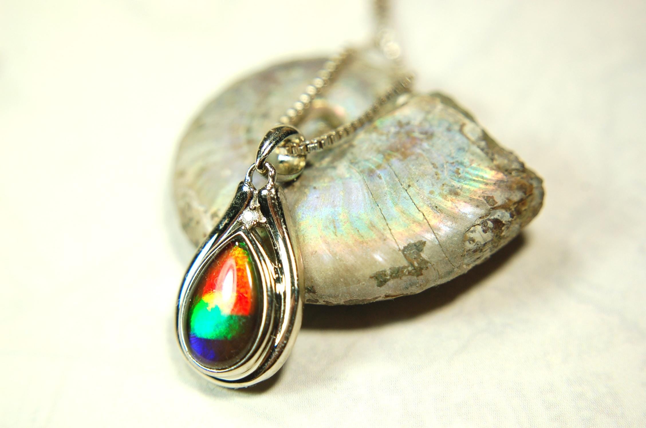 Buy Canadian Ammolite Pendant.Petite but very powerful colors.Perfect gift or gift for wife.Brilliant rainbow colors.Must see video.050429