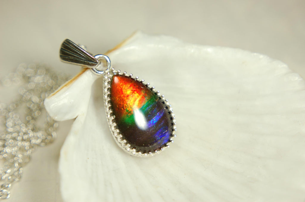 Dainty ammolite pendant.Brilliant color gem.Feminine jewelry.UniqueGift for her.Canadian gemstone.Sterling Silver setting.021126