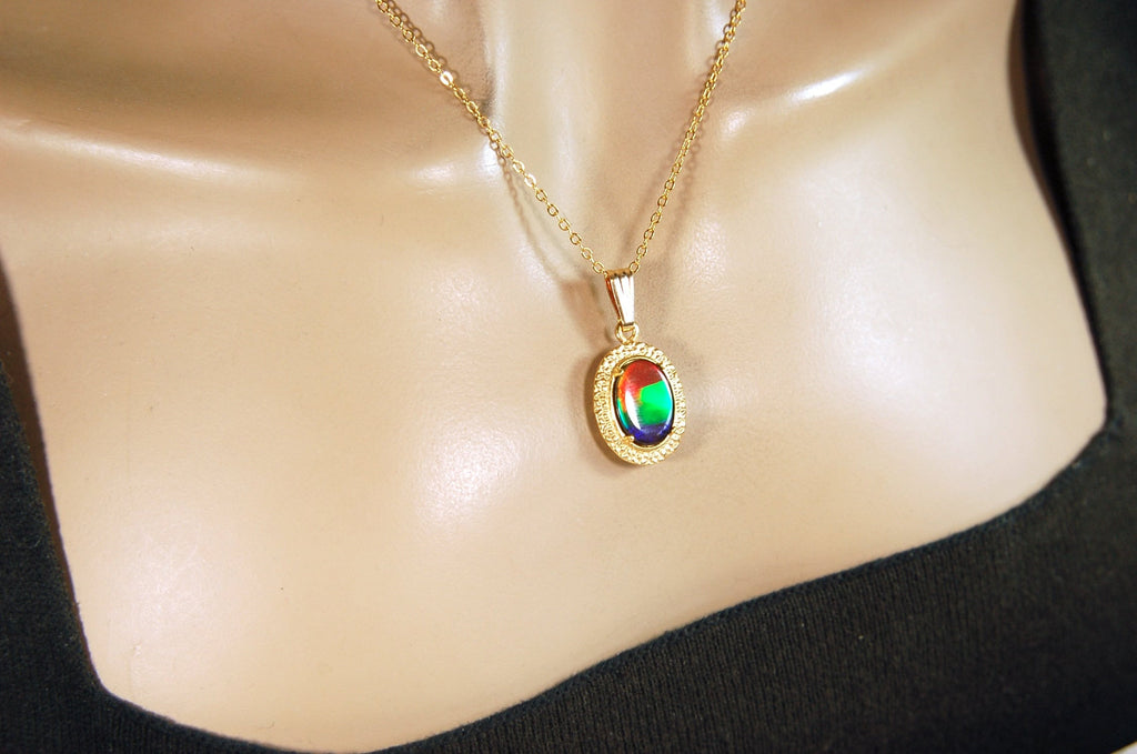 Genuine rainbow Ammolite pendant in 14k gold fill setting.#070414