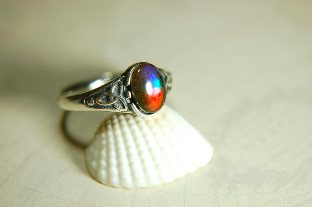 Ammolite Ladies Ring.Sterling Silver.Very feminine, has Celtic design and is in your size too!Brilliant tricolor gem.Gift for her?030816