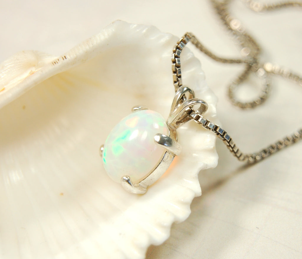 Opal pendant.Bright rolling colors. Desirable honeycomb gemstone.Perfect gift for her.MUST see colors in video.121213