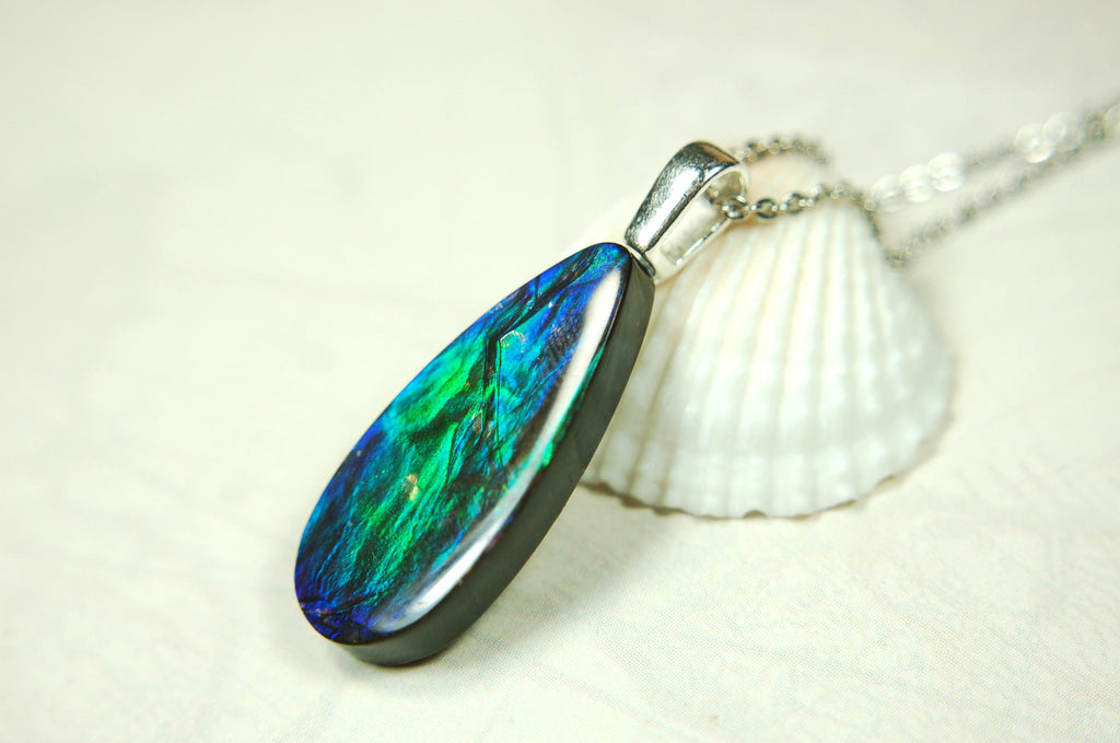 Ammolite Jewelry Pendant.All natural high quality cabochon from Alberta Canada.070715