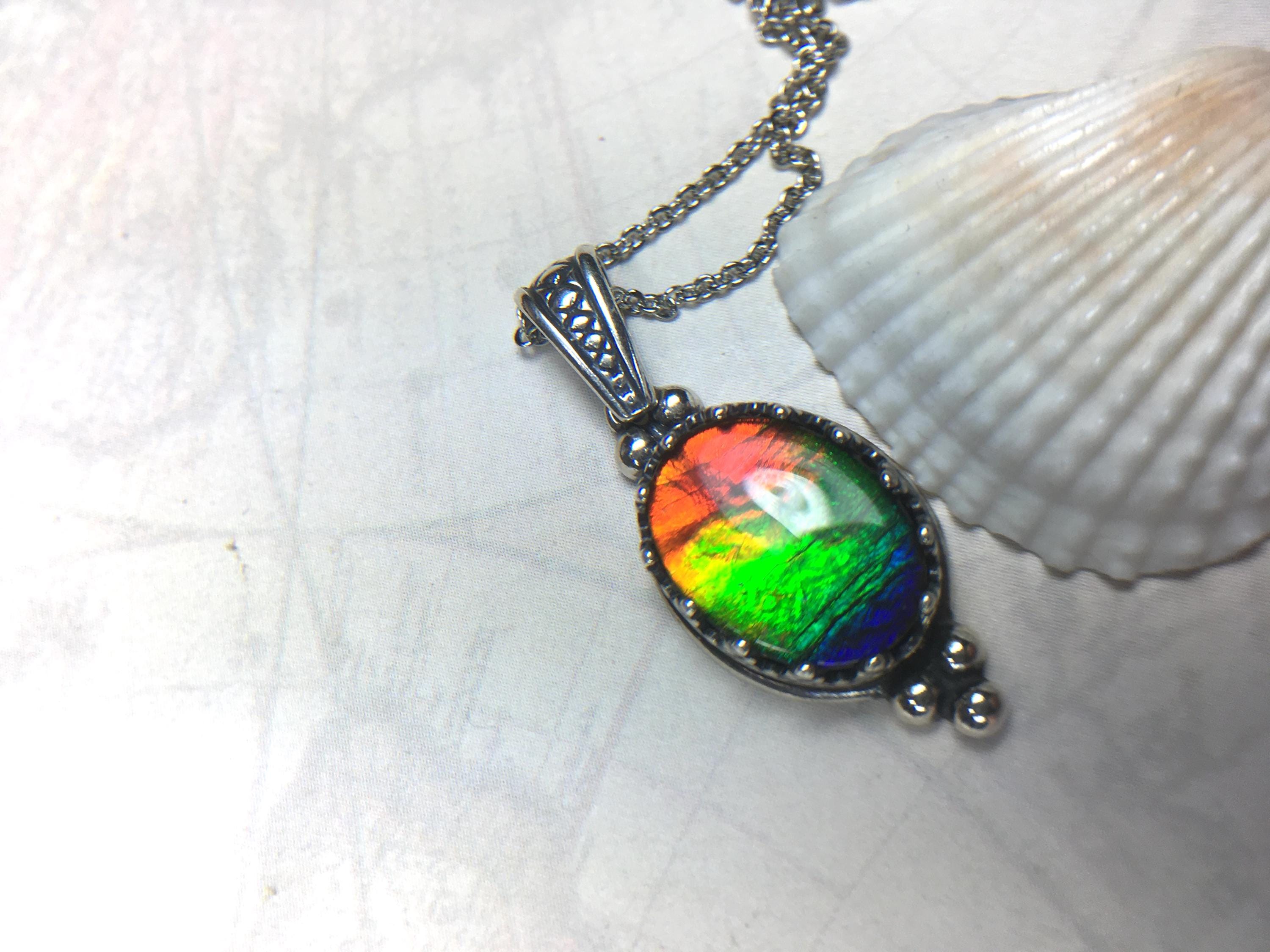 Genuine Ammolite Jewelry Pendant.Rainbow gem.Sterling Silver setting.No import taxes under CUSMA rules.062815