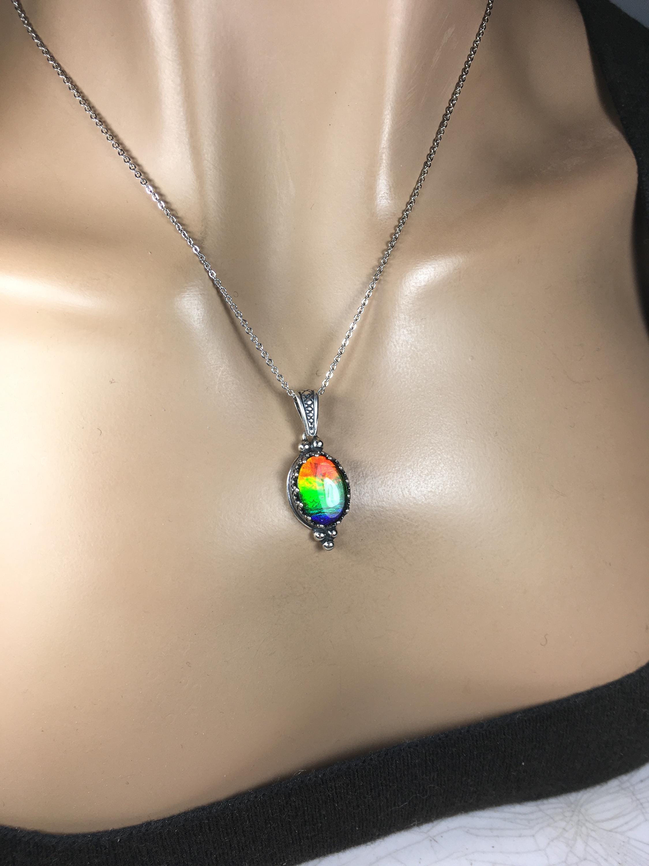Genuine Ammolite Jewelry Pendant.Rainbow gem.Sterling Silver setting.No import taxes under CUSMA rules.062815