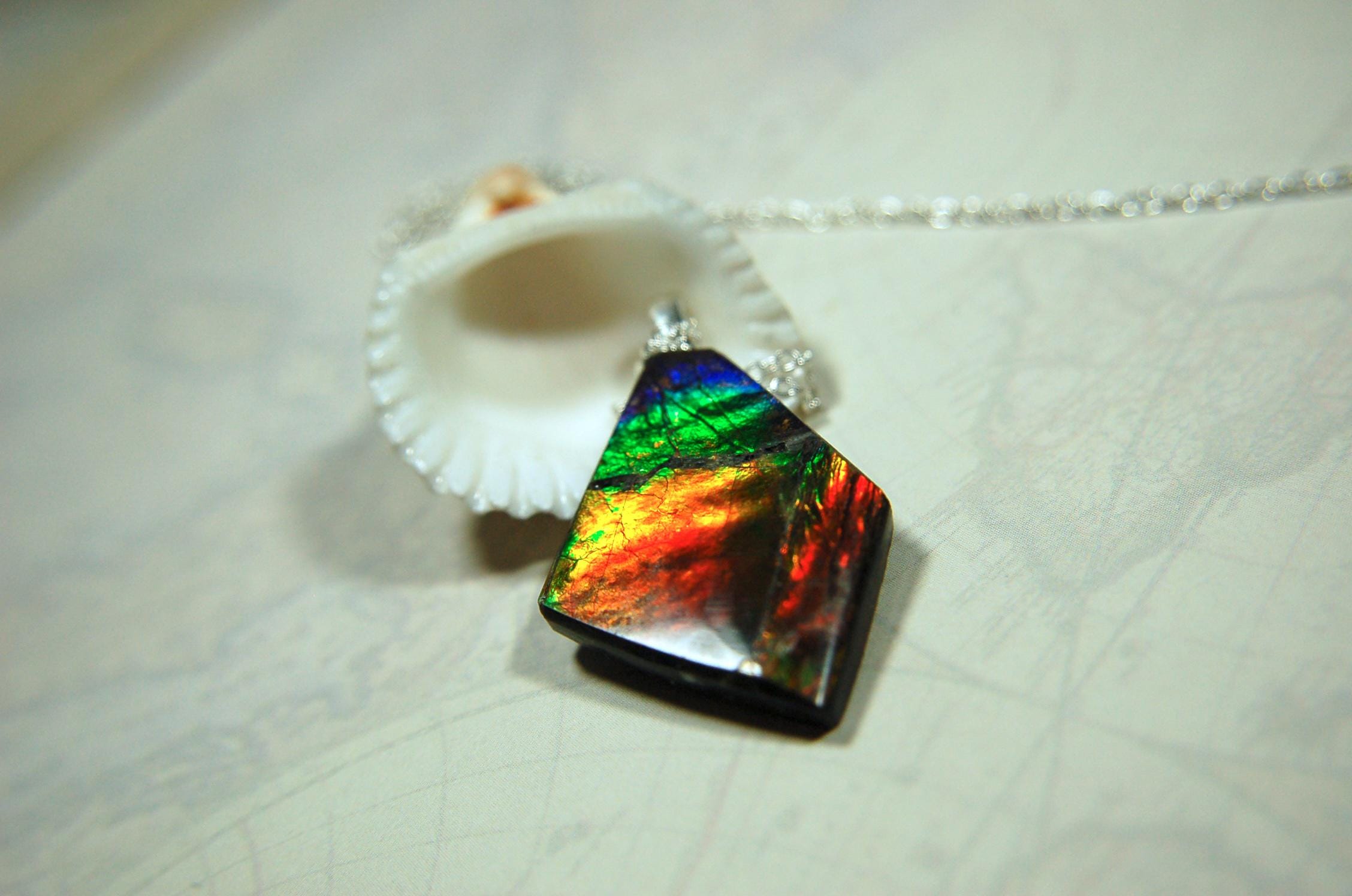 Ammolite pendant necklace.Unique raw natural cabochon with brilliant varied colors.Unisex design.Boho jewelry.031716