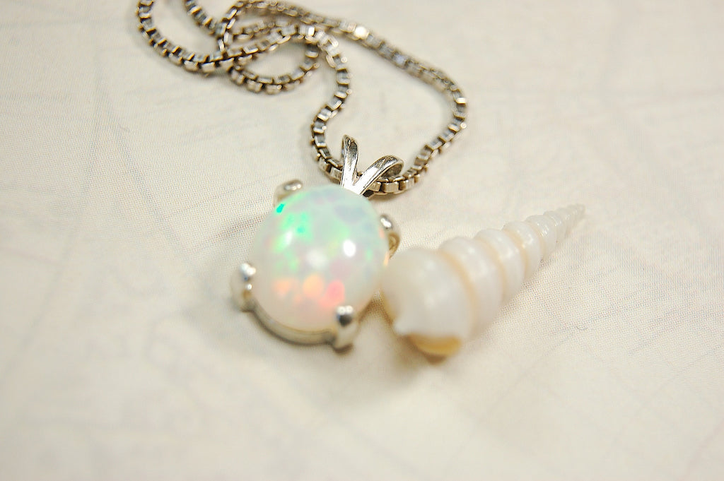 Opal pendant.Bright rolling colors. Desirable honeycomb gemstone.Perfect gift for her.MUST see colors in video.121213
