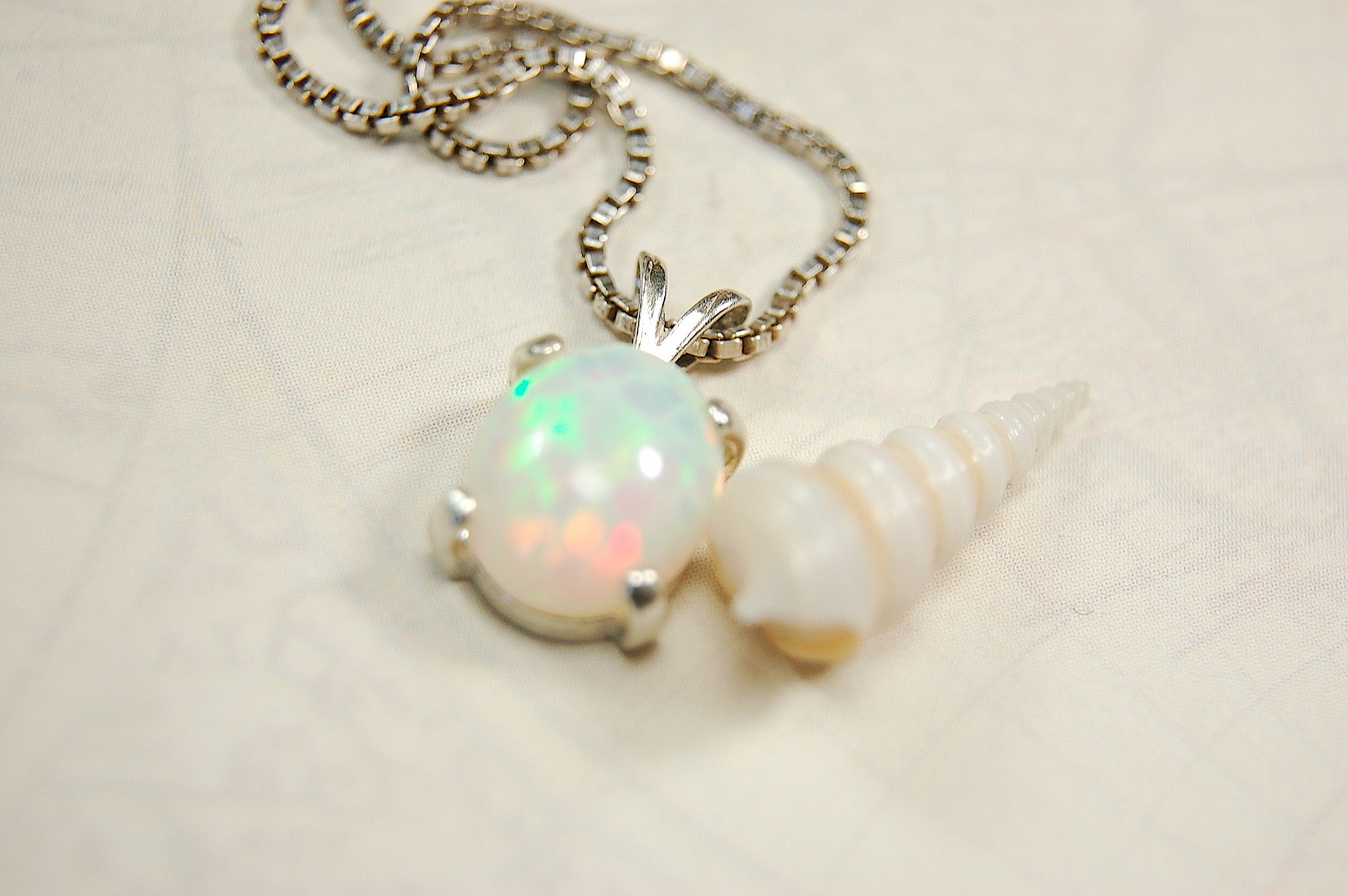 Opal pendant.Bright rolling colors. Desirable honeycomb gemstone.Perfect gift for her.MUST see colors in video.121213
