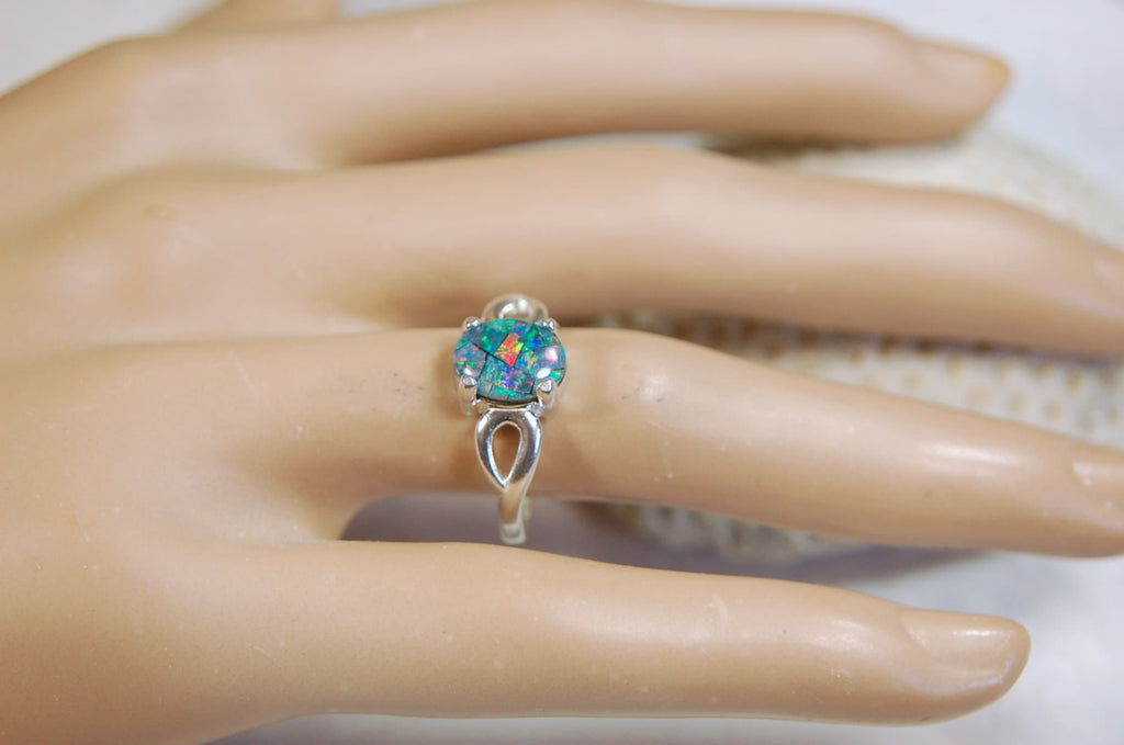 Australian Opal Ring.Gorgeous colors. Set in Sterling Silver.The perfect gift.Size 7 Boho style.