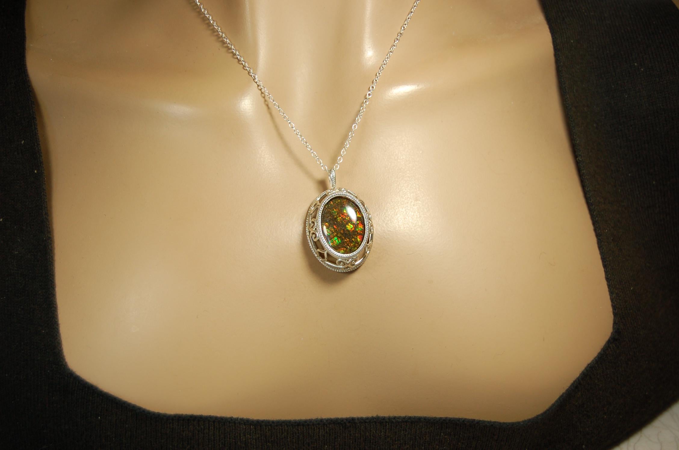 Unusual Ammolite pendant full of multicolor sparkles.A gift that will be treasured..032116