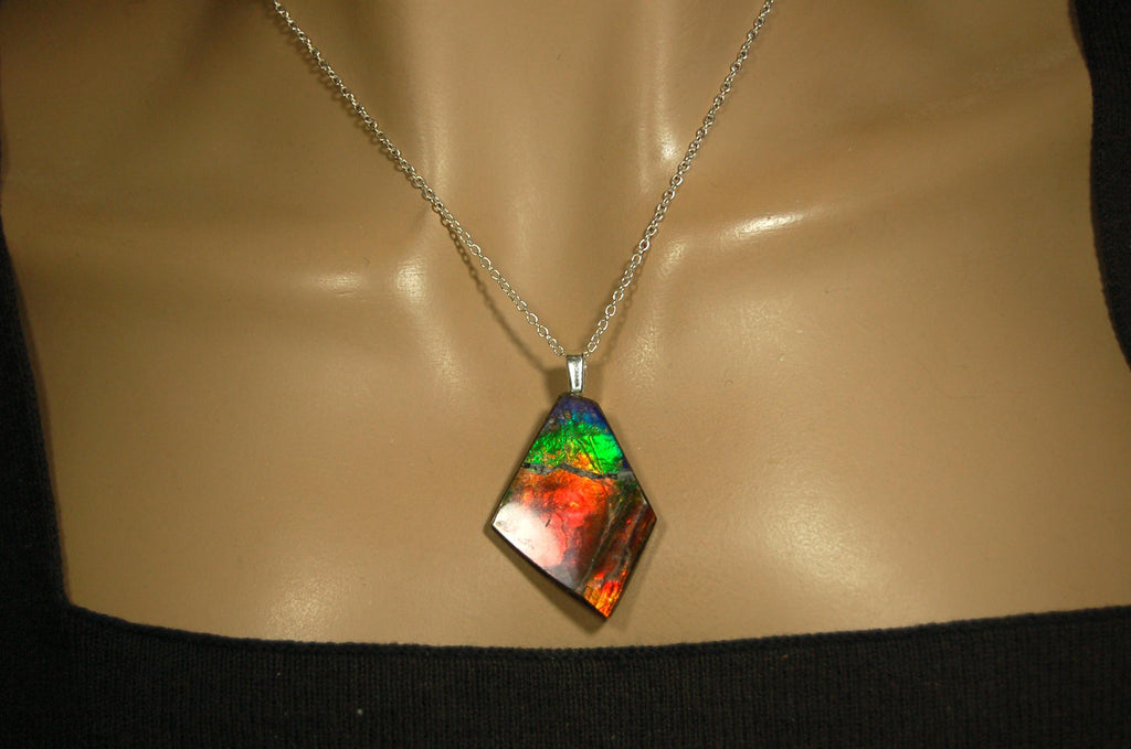 Ammolite pendant necklace.Unique raw natural cabochon with brilliant varied colors.Unisex design.Boho jewelry.031716