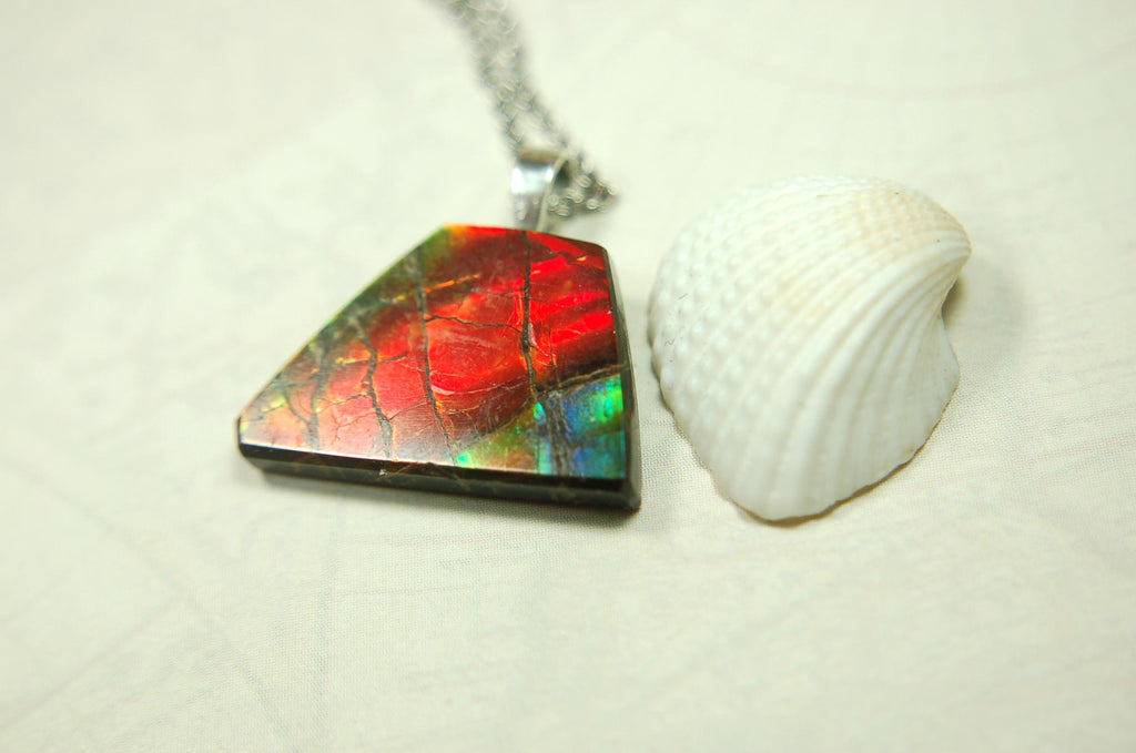 Natural Ammolite pendant with natural cabochon gem mined in Alberta Canada.070915