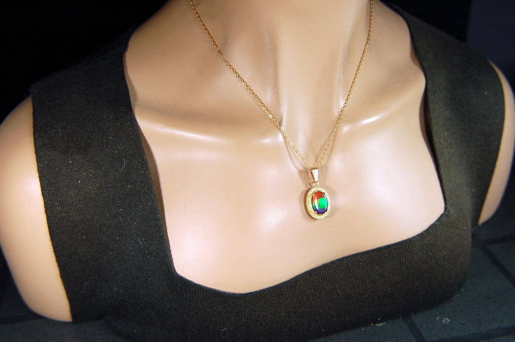 Genuine rainbow Ammolite pendant in 14k gold fill setting.#070414