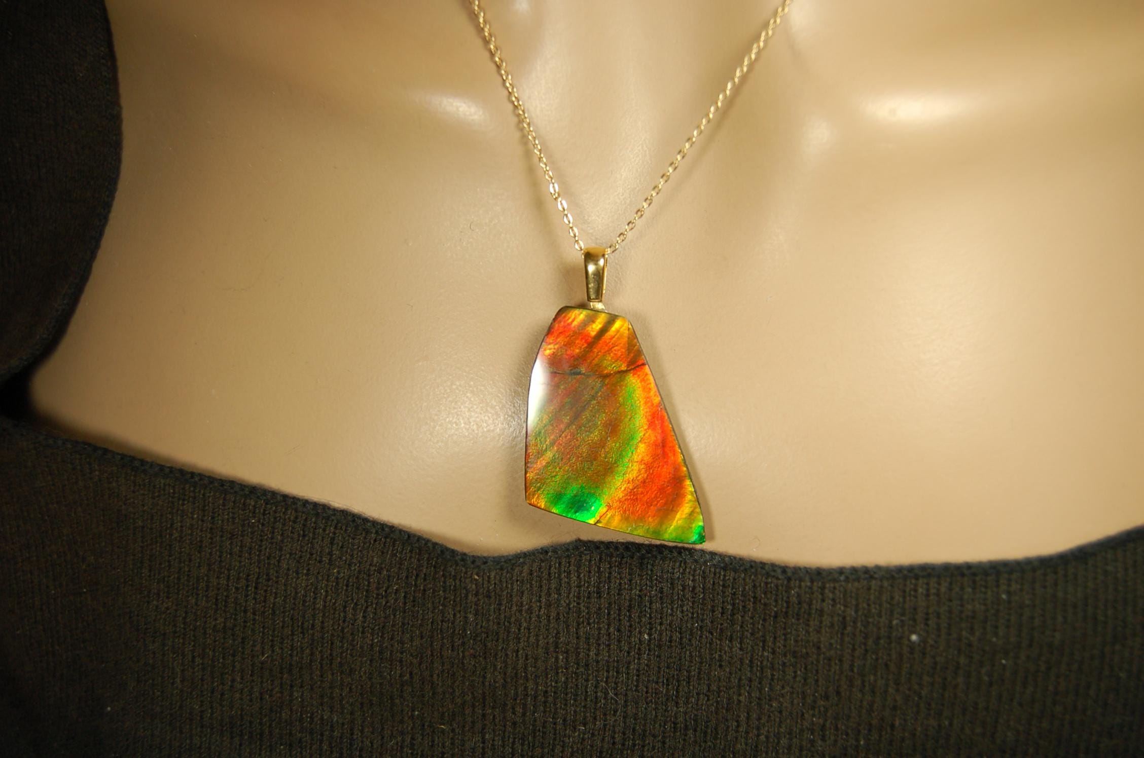 Ammolite Pendant.Natural Cabochon with strong color changing abilities.14kGF Gold bail.Elevate your style.030716