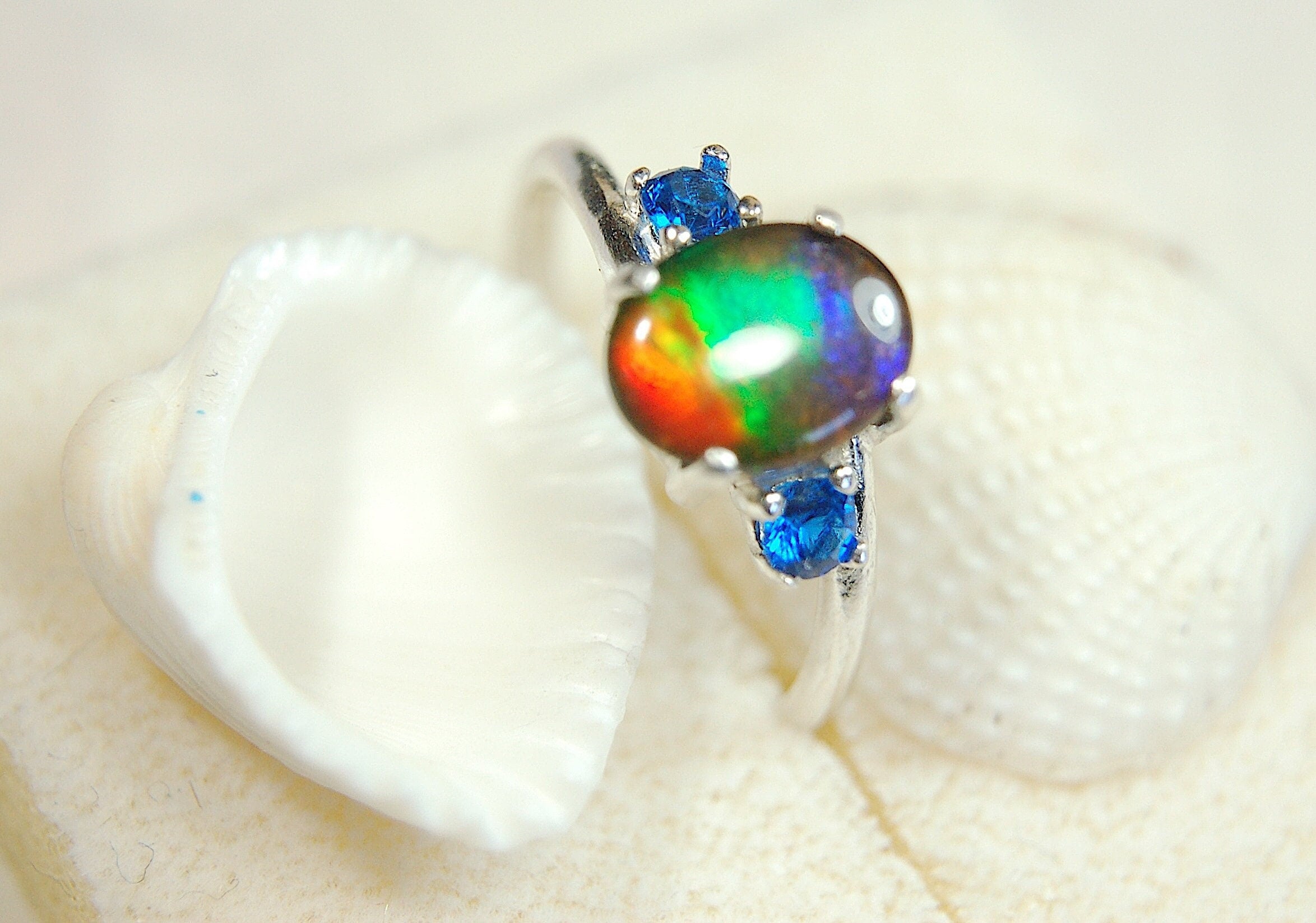 Ammolite Ring with brilliant Spinel side stones.Size 7.