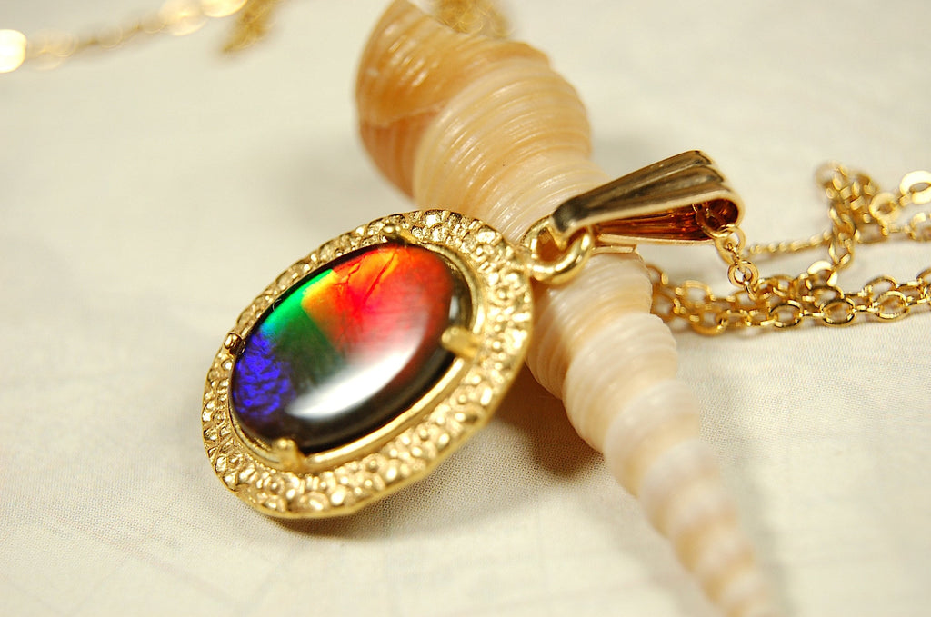 Genuine rainbow Ammolite pendant in 14k gold fill setting.#070414