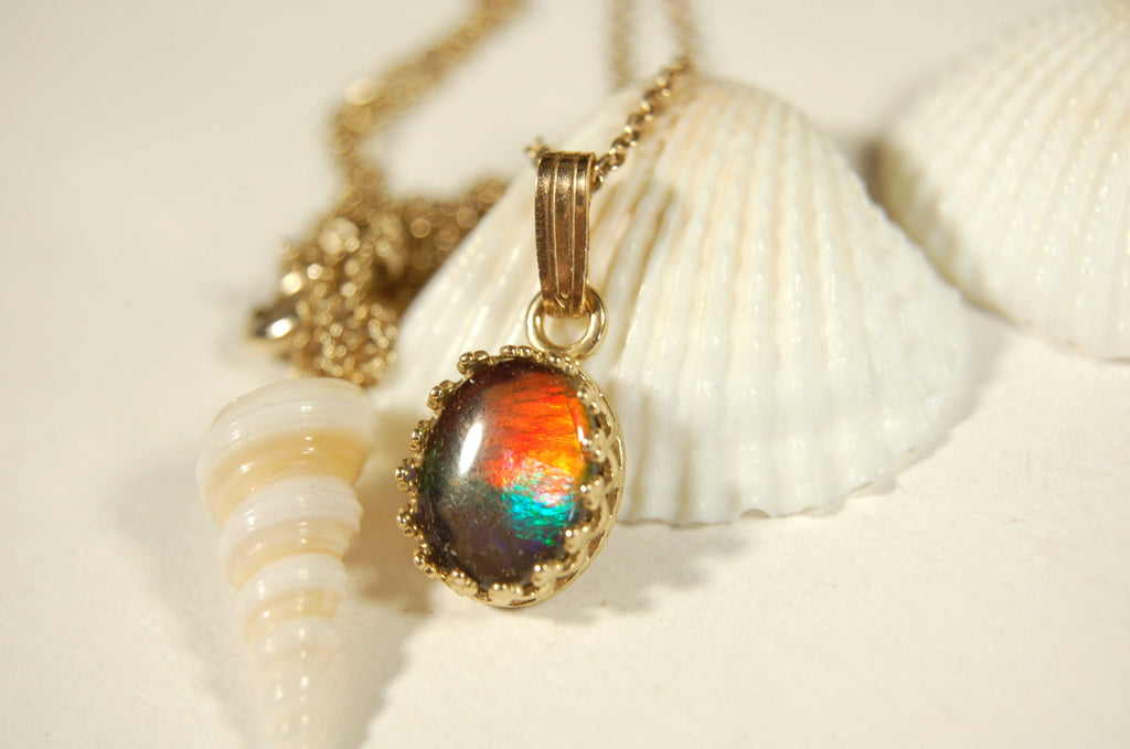 Gorgeous Ammolite pendant in 14k gold.Petite but powerful.Four color ammolite.Ammolite jewelry from Canada.Perfect gift. SEE VIDEO.060212