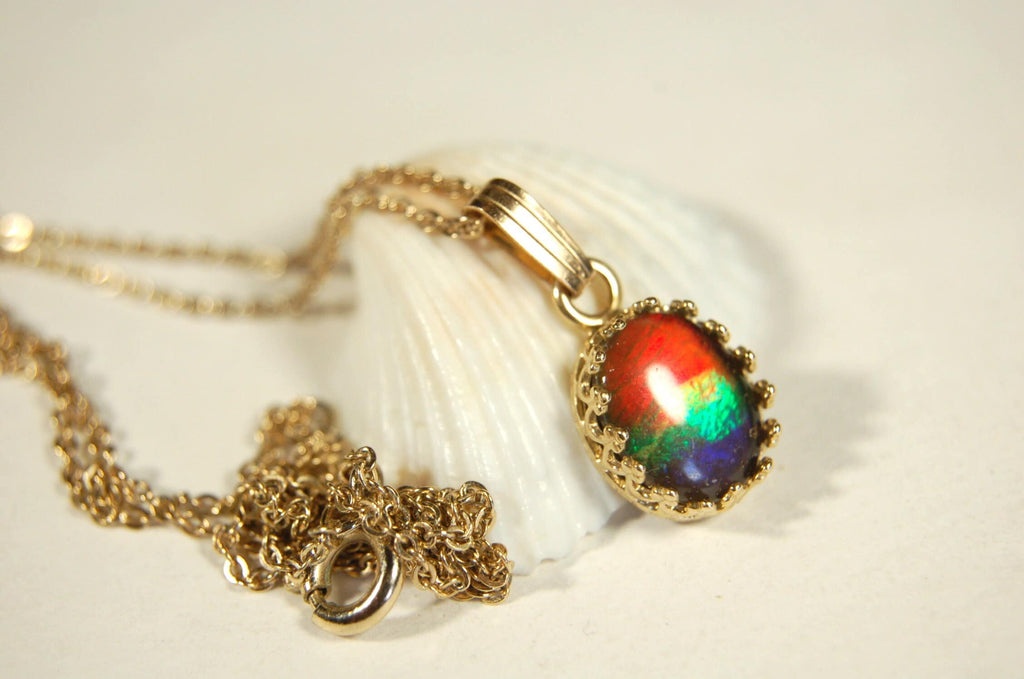 Gorgeous Ammolite pendant in 14k gold.Petite but powerful.Four color ammolite.Ammolite jewelry from Canada.Perfect gift. SEE VIDEO.060212
