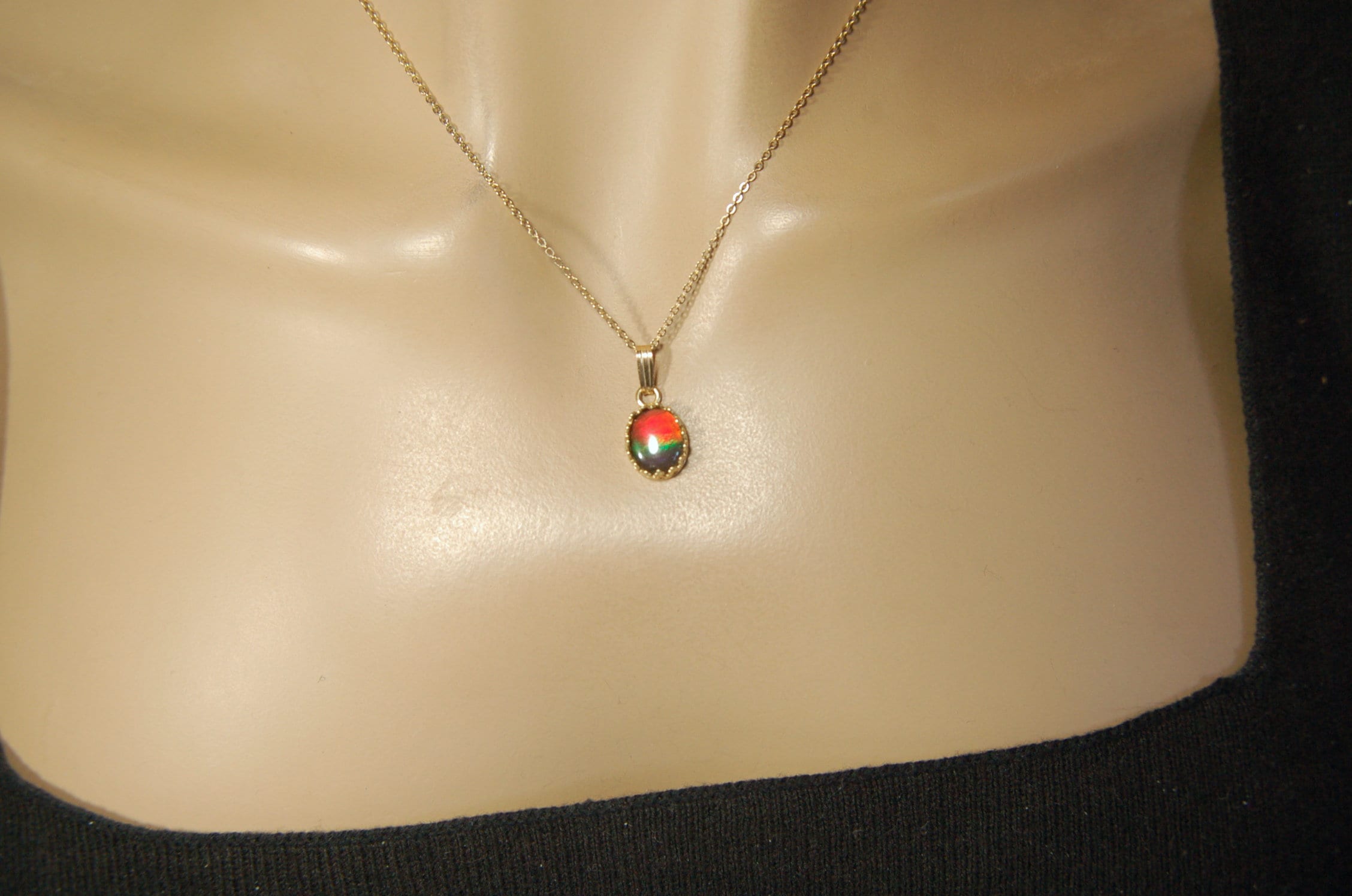 Gorgeous Ammolite pendant in 14k gold.Petite but powerful.Four color ammolite.Ammolite jewelry from Canada.Perfect gift. SEE VIDEO.060212