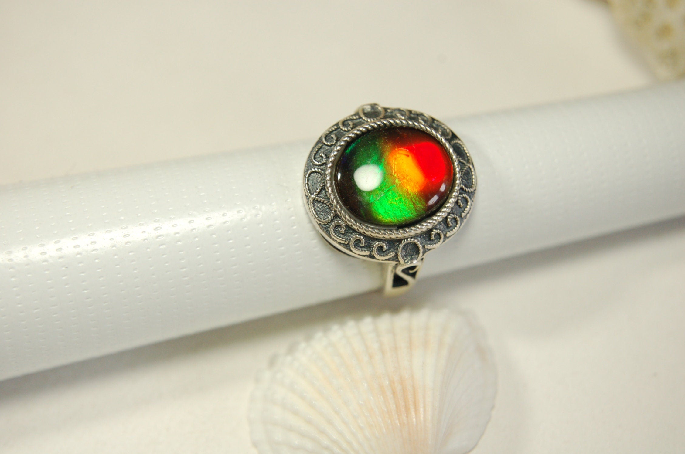 Ammolte Ring.Universal Fit.We pay to Fedex to you.Tax exempt under CUSMA rules.#021913