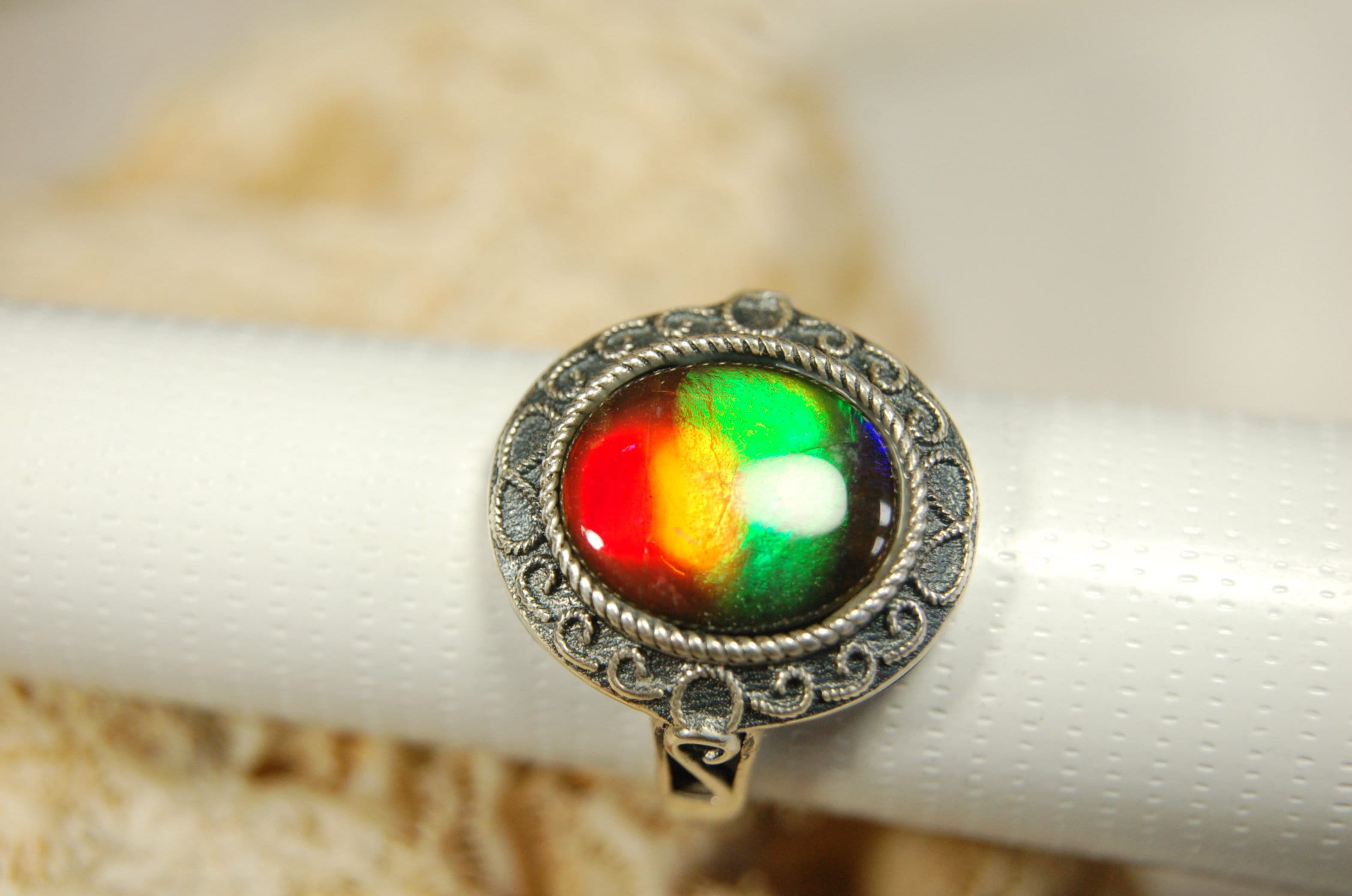 Ammolte Ring.Universal Fit.We pay to Fedex to you.Tax exempt under CUSMA rules.#021913
