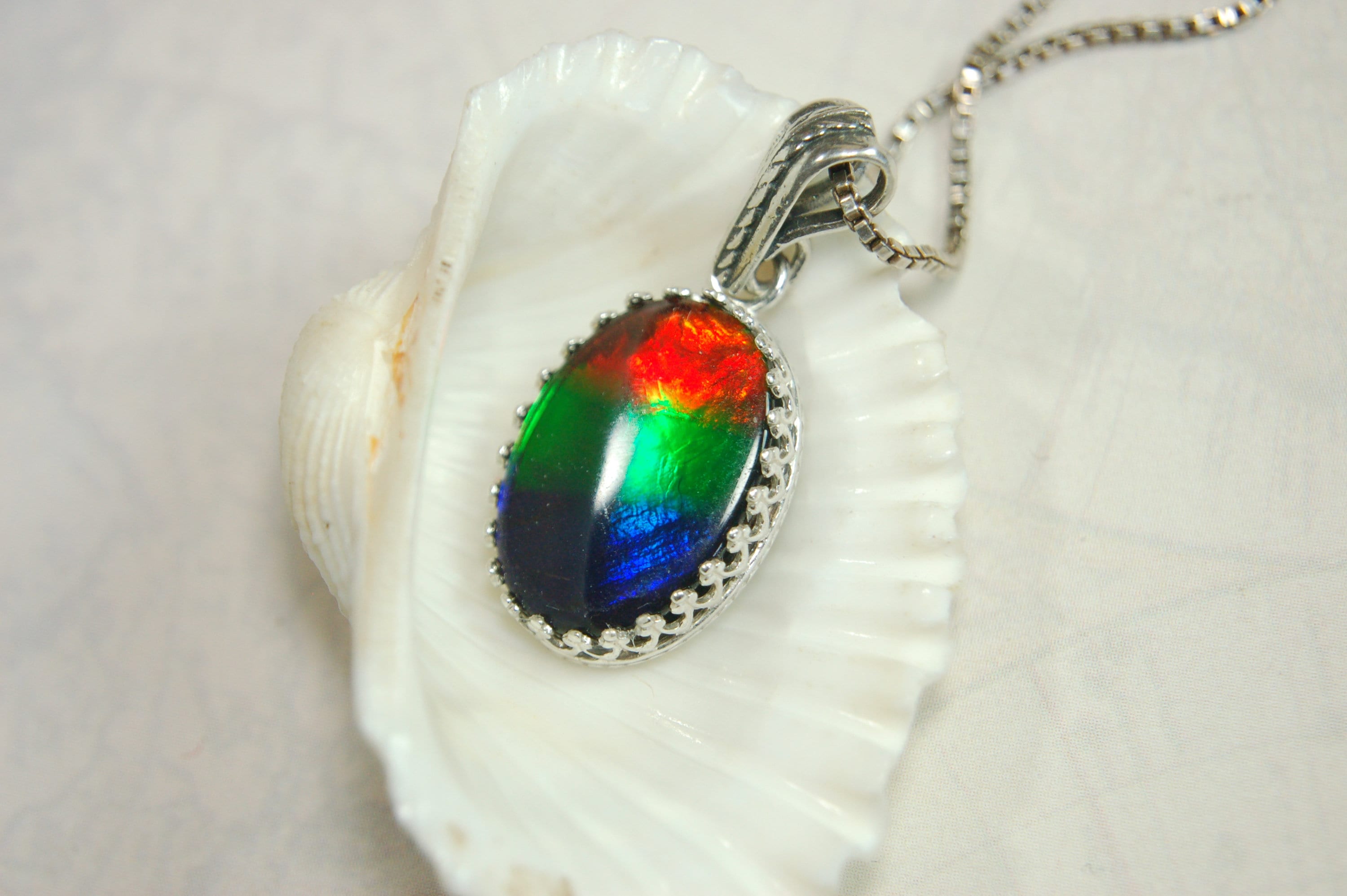 Colorful ammolite pendant - a one-of-a-kind addition to your collection or a perfect gift for someone special"021224