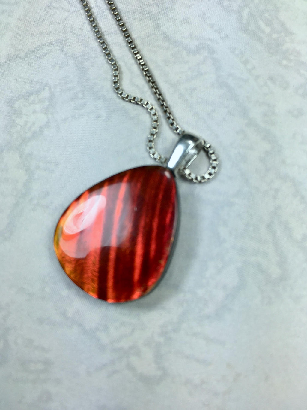 Red Ammolite Pendant with Tiger Stripes.Gift for wife.Brilliant color changing gem.All Natural Cabochon gem.MUST see video.062325
