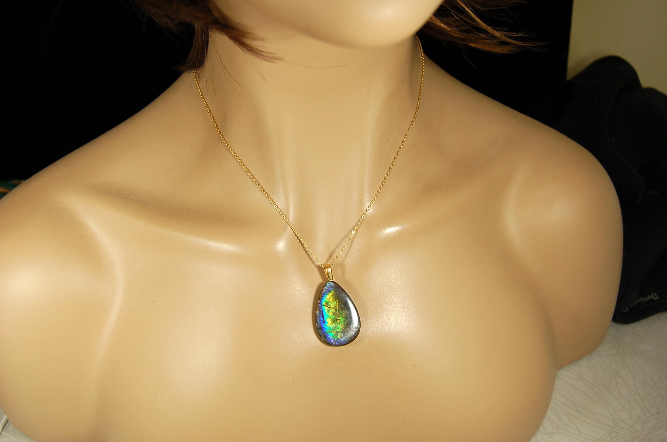 Ammolite Pendant with peacock colors.Natural cabochon gemstone mined and shipped from Canada.Gift of unique jewelry.MUST SEE VIDEO.020926