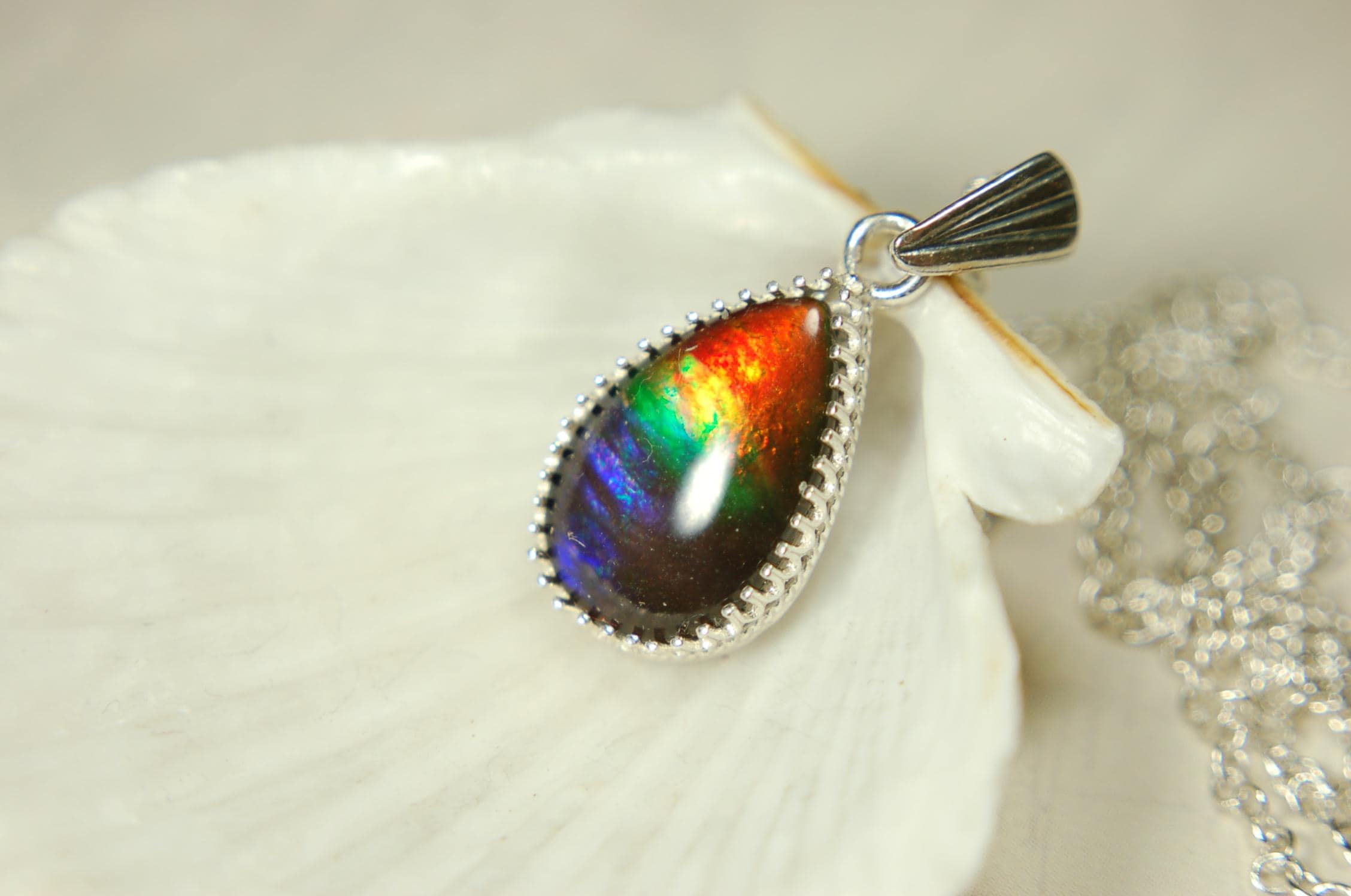 Dainty ammolite pendant.Brilliant color gem.Feminine jewelry.UniqueGift for her.Canadian gemstone.Sterling Silver setting.021126
