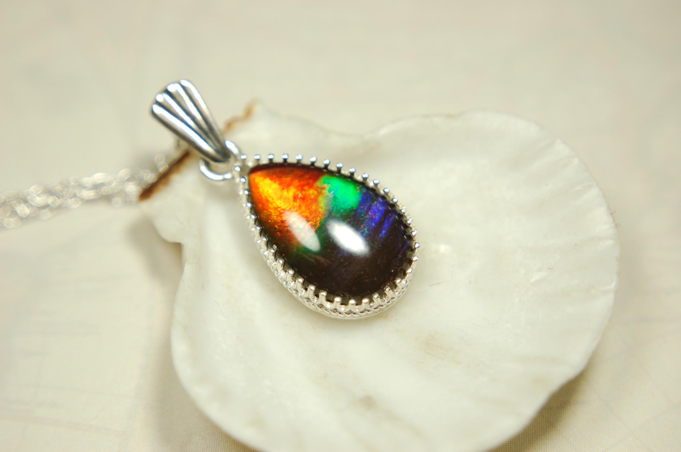 Dainty ammolite pendant.Brilliant color gem.Feminine jewelry.UniqueGift for her.Canadian gemstone.Sterling Silver setting.021126