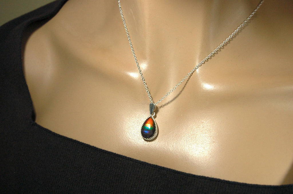 Dainty ammolite pendant.Brilliant color gem.Feminine jewelry.UniqueGift for her.Canadian gemstone.Sterling Silver setting.021126