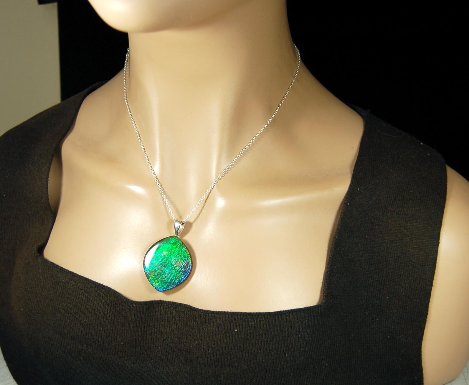 Ammolite pendant for lovers of green this is the one.High quality genuine gem from Alberta Canada.Big impact pendant.021226