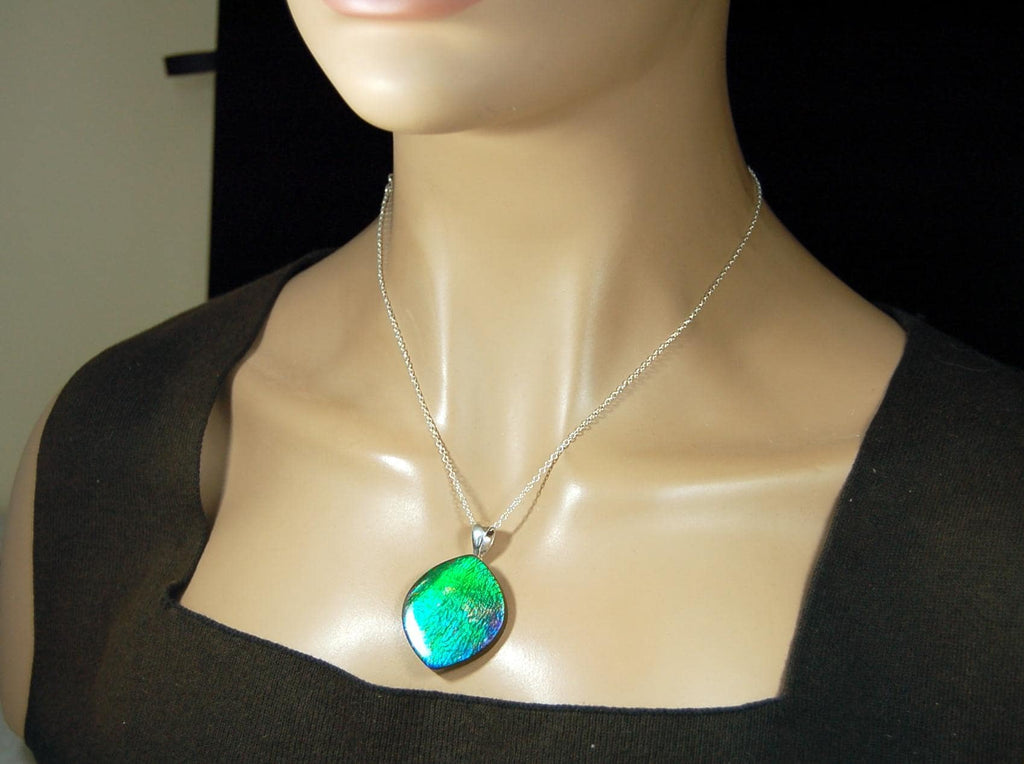 Ammolite pendant for lovers of green this is the one.High quality genuine gem from Alberta Canada.Big impact pendant.021226