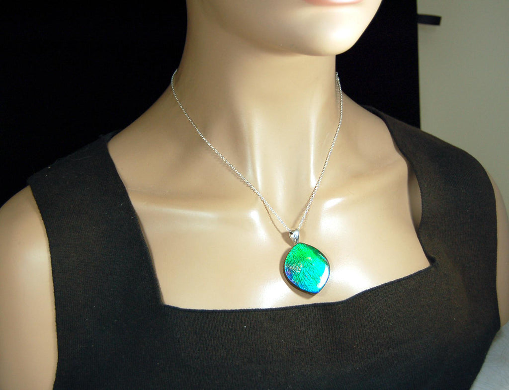Ammolite pendant for lovers of green this is the one.High quality genuine gem from Alberta Canada.Big impact pendant.021226