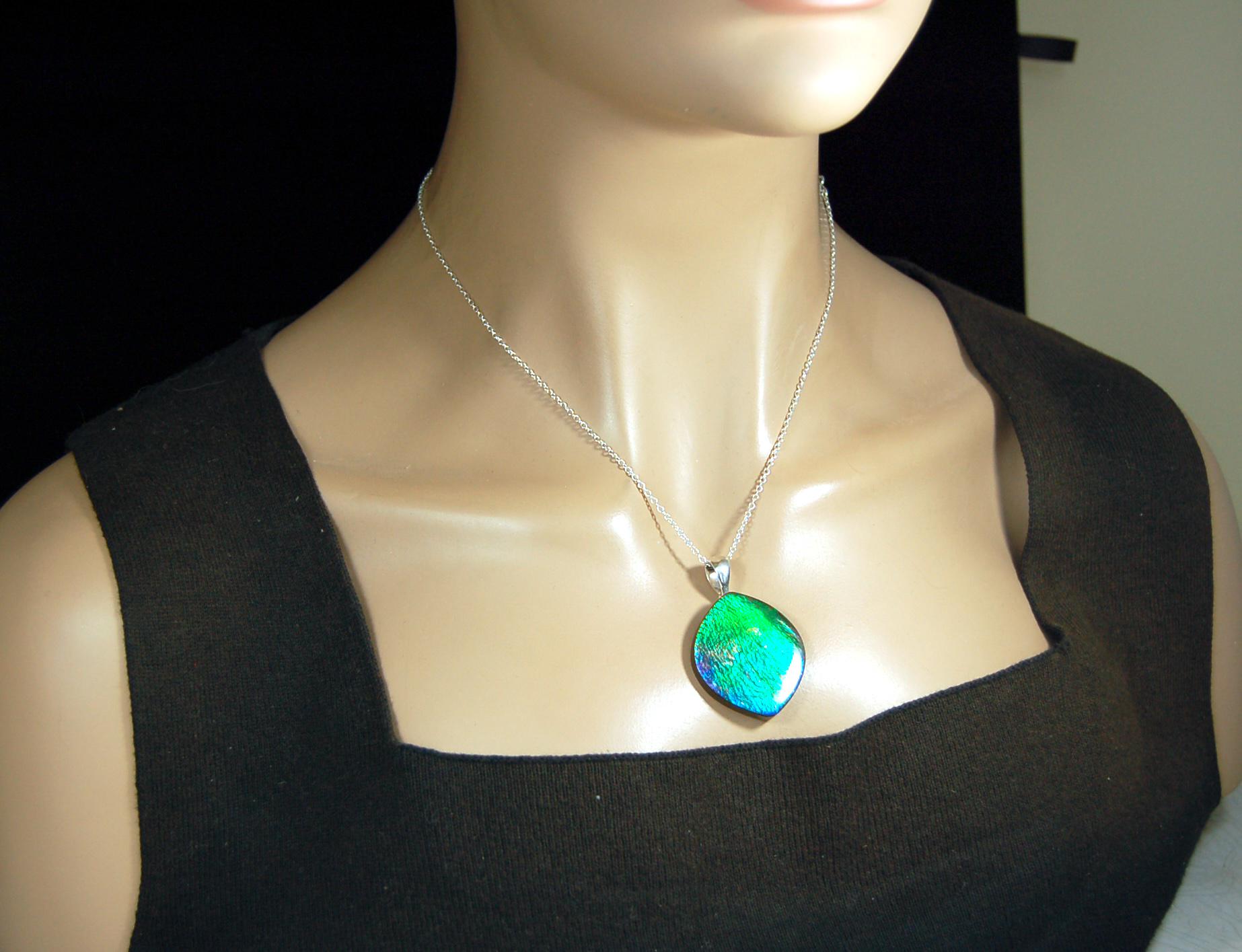 Ammolite pendant for lovers of green this is the one.High quality genuine gem from Alberta Canada.Big impact pendant.021226