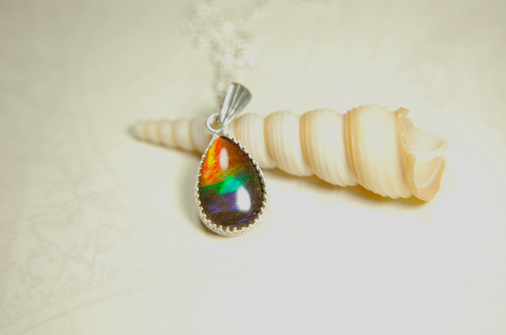 Dainty ammolite pendant.Brilliant color gem.Feminine jewelry.UniqueGift for her.Canadian gemstone.Sterling Silver setting.021126
