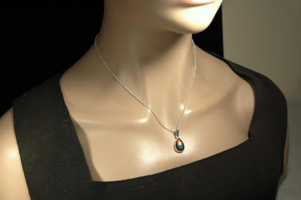 Dainty ammolite pendant.Brilliant color gem.Feminine jewelry.UniqueGift for her.Canadian gemstone.Sterling Silver setting.021126