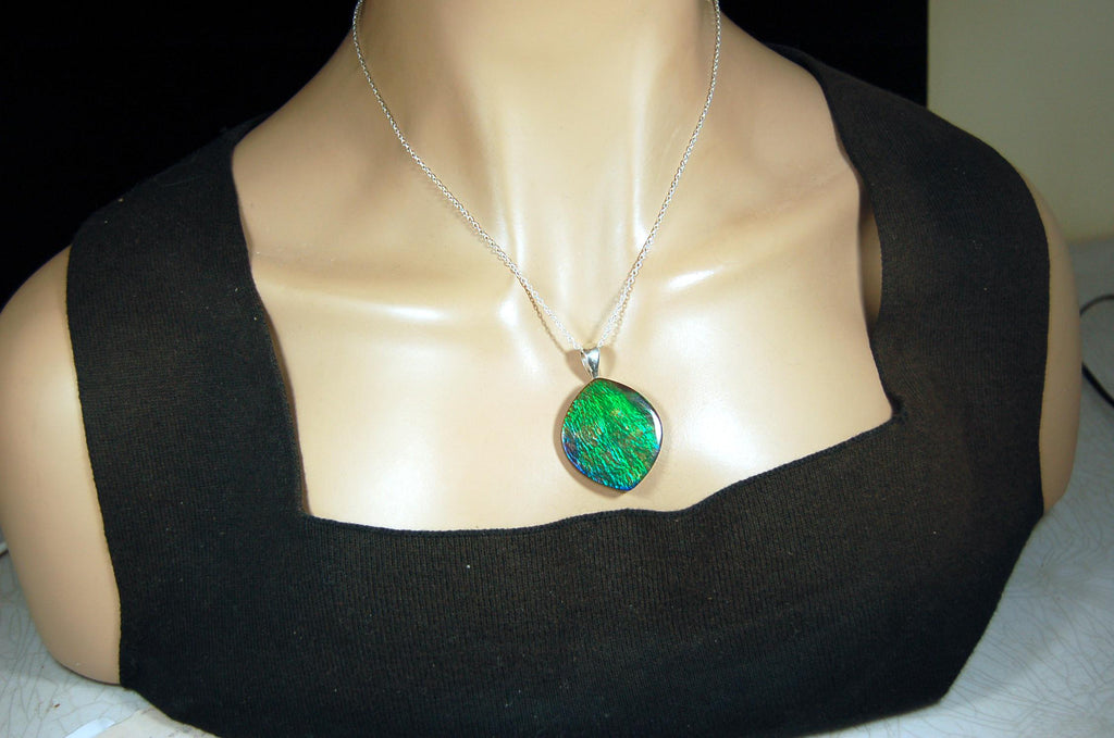 Ammolite pendant for lovers of green this is the one.High quality genuine gem from Alberta Canada.Big impact pendant.021226