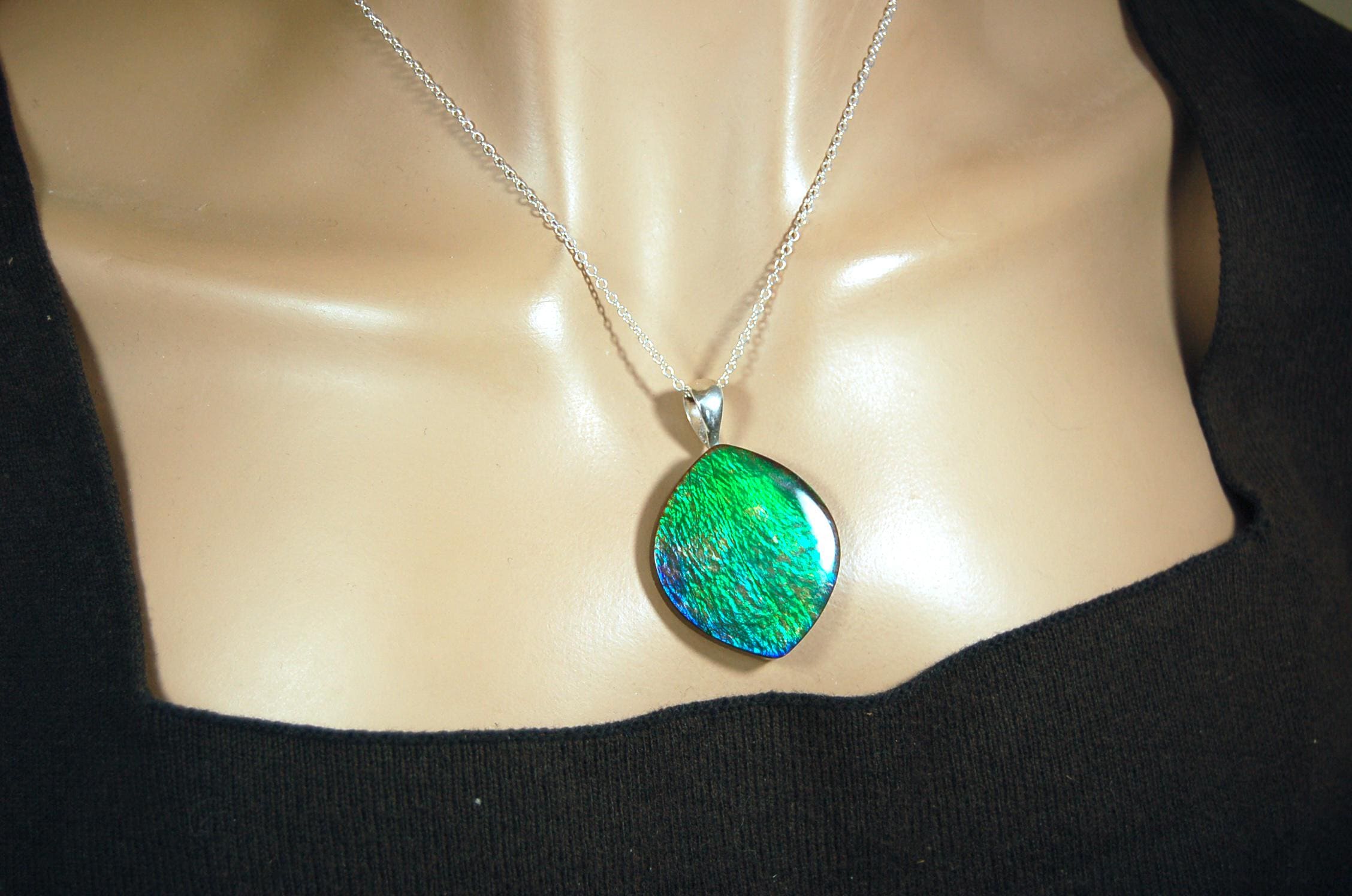 Ammolite pendant for lovers of green this is the one.High quality genuine gem from Alberta Canada.Big impact pendant.021226