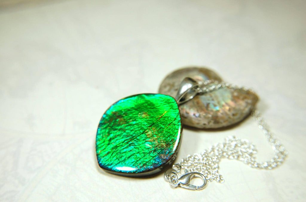 Ammolite pendant for lovers of green this is the one.High quality genuine gem from Alberta Canada.Big impact pendant.021226