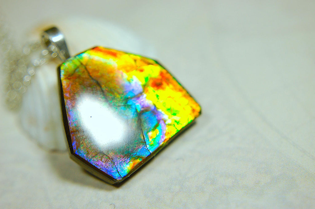 Ammolite pendant.RARE colors.Best seen in video.All natural cabochon from Alberta Canada.Thoughtful gift for her.022716