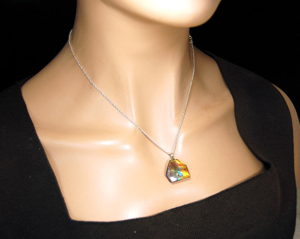 Ammolite pendant.RARE colors.Best seen in video.All natural cabochon from Alberta Canada.Thoughtful gift for her.022716