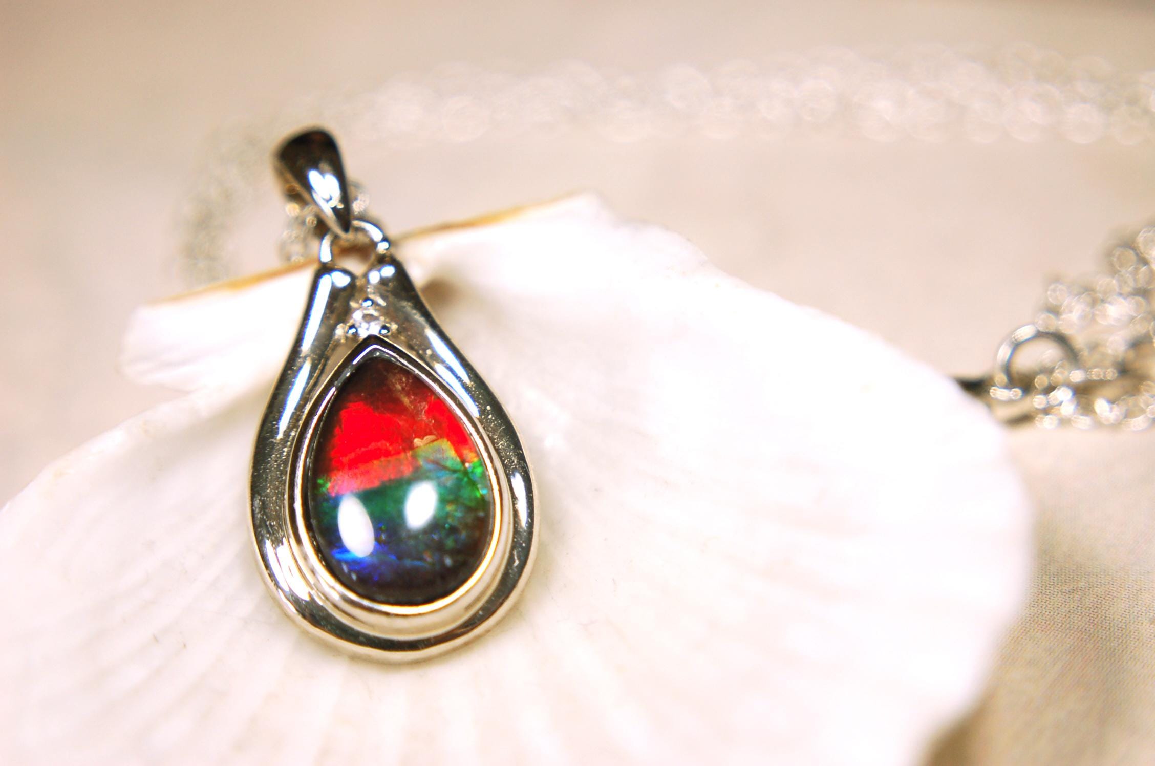 Ammolite pendant.Petite,feminine but very powerful.Rainbow color gem with sapphire.Birthday or Anniversary Gift for wife? 030416