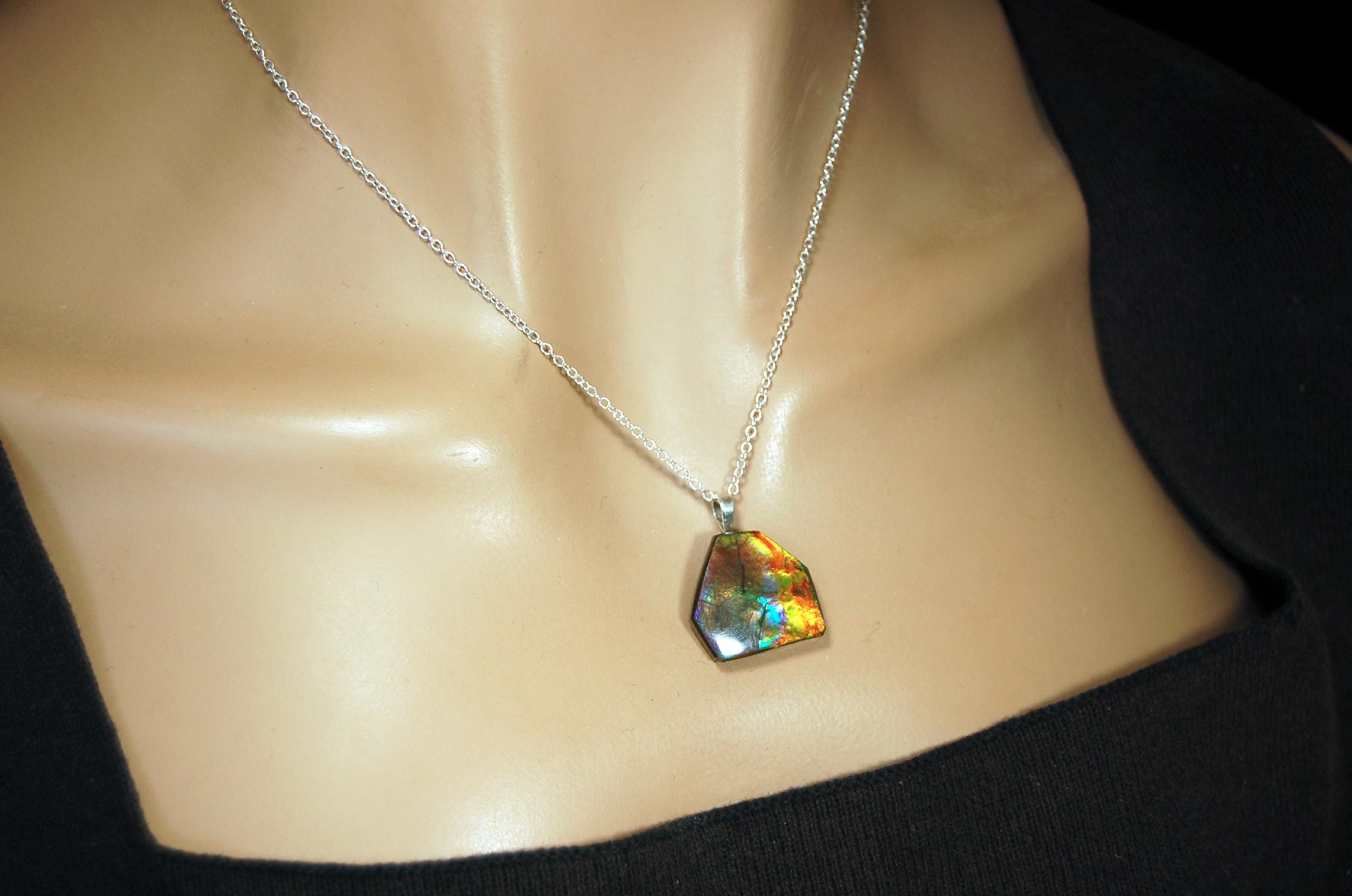 Ammolite pendant.RARE colors.Best seen in video.All natural cabochon from Alberta Canada.Thoughtful gift for her.022716