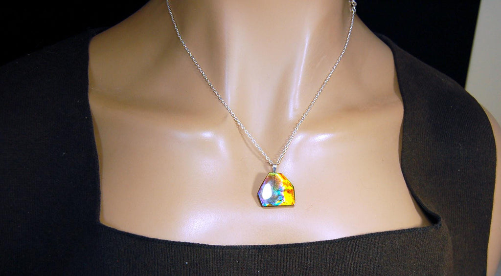Ammolite pendant.RARE colors.Best seen in video.All natural cabochon from Alberta Canada.Thoughtful gift for her.022716