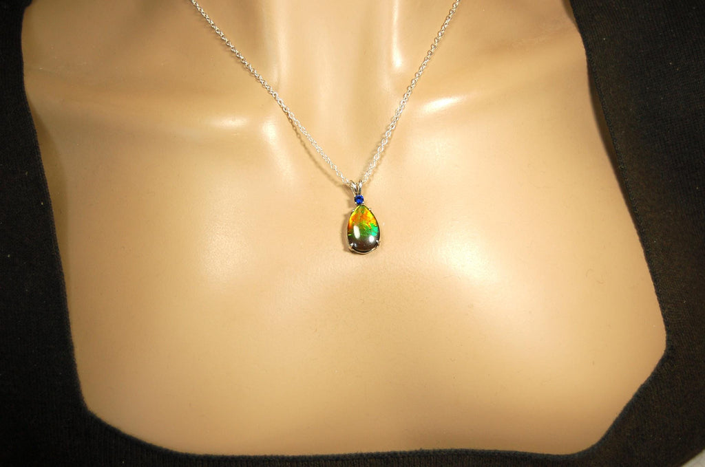 Sterling Silver set Ammolite Pendant with blue Sapphire.A gift idea for your wife she will treasure.Must see video.060916