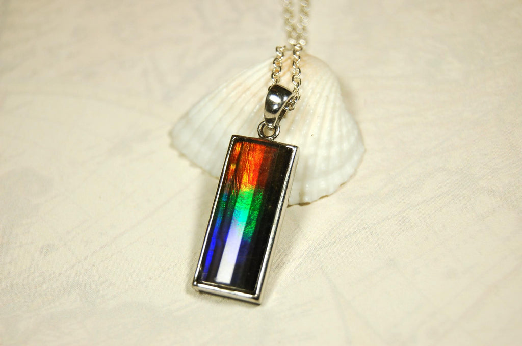 Unisex Jewelry.Ammolite Pendant.Bright Faceted rainbow gem.Price Reduced--see disclosure below in description