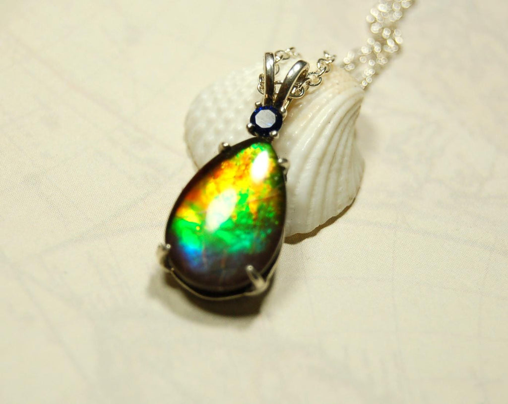 Sterling Silver set Ammolite Pendant with blue Sapphire.A gift idea for your wife she will treasure.Must see video.060916