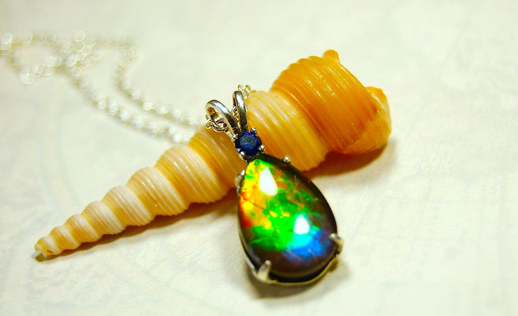 Sterling Silver set Ammolite Pendant with blue Sapphire.A gift idea for your wife she will treasure.Must see video.060916
