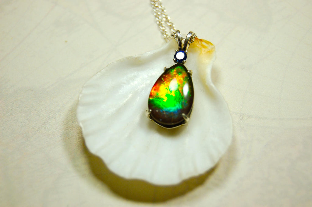 Sterling Silver set Ammolite Pendant with blue Sapphire.A gift idea for your wife she will treasure.Must see video.060916