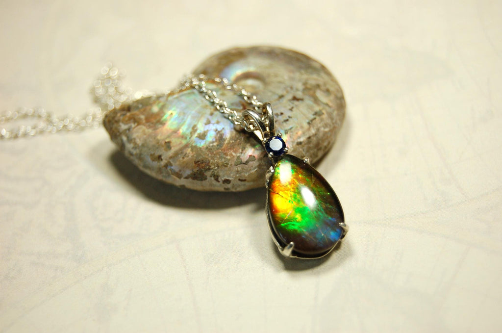 Sterling Silver set Ammolite Pendant with blue Sapphire.A gift idea for your wife she will treasure.Must see video.060916